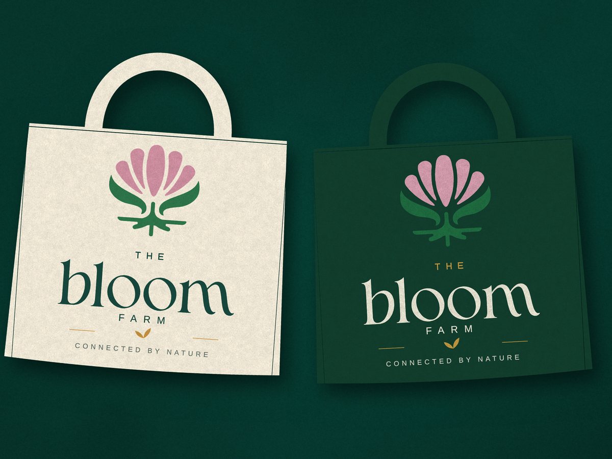Two Bloom Farm shopping bags, one cream and one forest green, each with the Bloom logo.